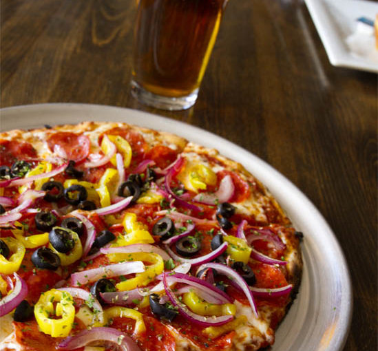 PEPPERONI PIZZA with yellow and red onions