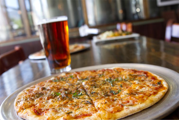 Six Cheese Pizza with beer